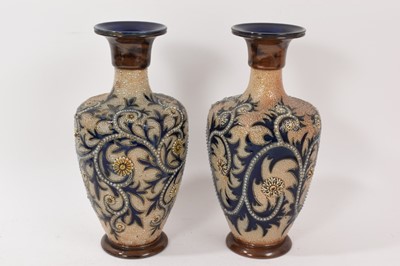 Lot 257 - Pair of Royal Doulton stoneware vases decorated with scrolling foliate patterns by Bessie Newbery, marks to bases, 26.5cm high