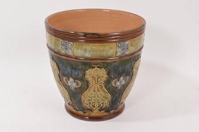 Lot 262 - Royal Doulton stoneware jardinière, decorated with foliate patterns in tones of green and blue, 19.5cm high