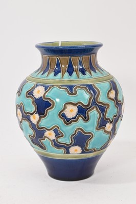 Lot 266 - Burmantofts faience vase, decorated with flower heads against a two-tone blue ground, impressed marks, 18cm high