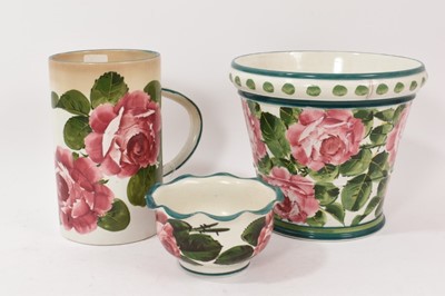 Lot 267 - Three pieces of Wemyss pottery decorated with roses, including a jardinière, large tankard and small vase (3)