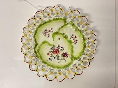 Lot 368 - 18th century Chelsea porcelain reticulated and leaf moulded plate with polychrome floral decoration.