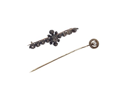 Lot 1056 - Antique diamond bar brooch set with rose cut diamonds in closed back claw setting, together with a gold stick pin