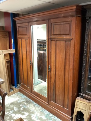 Lot 1365 - Late Victorian walnut triple wardrobe with interior drawers and slides, 190cm wide, 57cm deep, 213cm high