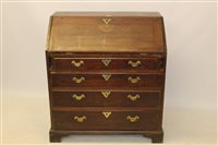 Lot 1734 - George II mahogany bureau with sloping fall...