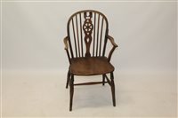 Lot 1744 - 19th century ash and elm wheelback elbow chair...