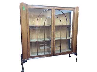 Lot 1410 - 1920's mahogany display cabinet with shelved interior enclosed by two glazed doors, 118cm wide, 34cm deep, 124cm high