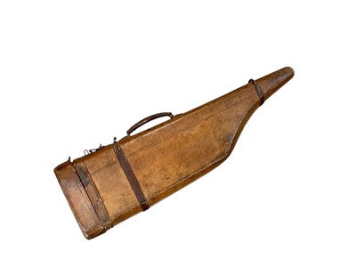 Lot 945 - Antique tan leather leg of mutton gun case.