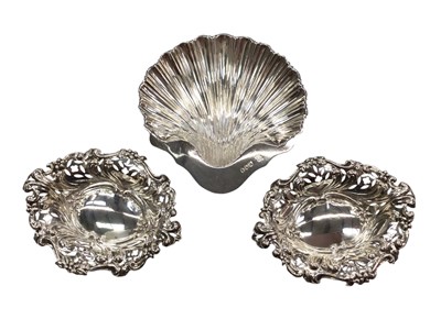 Lot 1071 - Silver shell shaped butter dish and a pair of silver bon bon dishes with pierced decoration