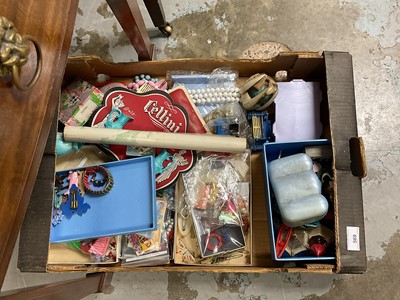 Lot 569 - Four boxes of assorted toys to include dolls house items and board games.