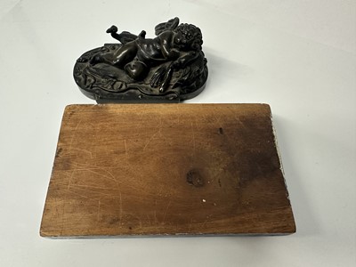 Lot 1104 - Francesco Fanelli (1577-c.1657) bronze - Sleeping Cupid, related paperwork beneath