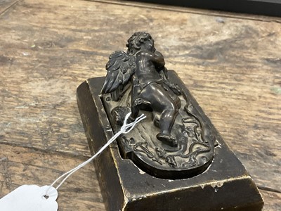 Lot 1104 - Francesco Fanelli (1577-c.1657) bronze - Sleeping Cupid, related paperwork beneath