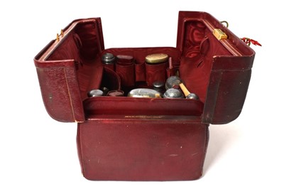 Lot 561 - Mappin & Webb vanity case containing a collection of silver topped bottles