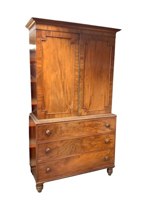 Lot 1569 - George IV mahogany two-height linen press