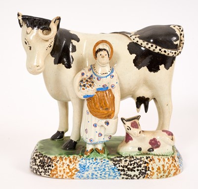 Lot 280 - Rare Yorkshire Don Pottery group of a cow, calf, and gardener, circa 1780-1820, decorated in Pratt colours, 15cm high