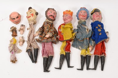 Lot 1094 - Antique, probably early 20th century set of papier mâché Punch and Judy puppets, eight in total including baby and dog, together with a book 'Punch and Judy' illustrated by George Cruickshank