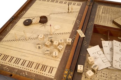 Lot 1095 - Rare boxed musical game, patented by Ann Young, 1801, with folding mahogany case, opening to reveal paper lined playing surface, with end drawers and well enclosing various engraved ivory dice,...