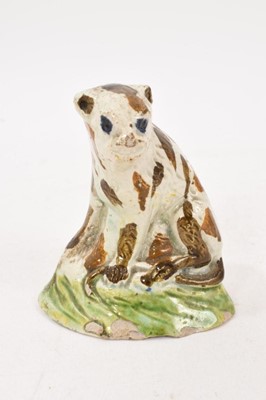 Lot 288 - Prattware model of a wild animal, circa 1810, with brown streaked fur and blue eyes, on a green base, 7cm high