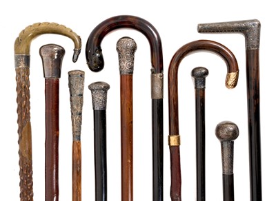 Lot 1113 - Good collection of silver mounted walking sticks, predominantly Victorian, including an ebony cane with angular handle, Indian bamboo cane with animal embossed handle, tortoiseshell handled cane...