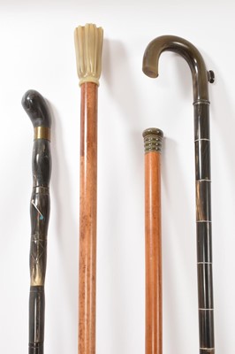 Lot 1115 - Collection of antique horn walking sticks, including 19th century malacca stick with turned horn knop, three others. (4)