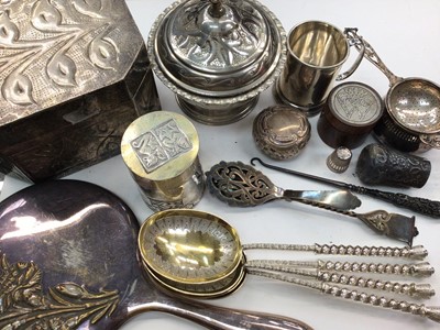 Lot 1125 - Silver tea strainer and stand, small silver tankard, silver cane knop, silver mounted wooden box, Eastern white metal pot and cover, set of four good quality plated serving spoons and other plat...