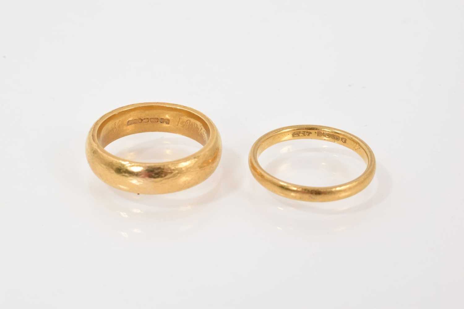 Lot 680 - Two 22ct gold wedding bands