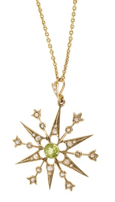 Lot 604 - Edwardian 9ct gold peridot and seed pearl star shaped open work pendant on 9ct gold chain