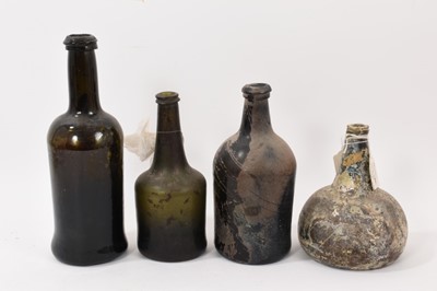 Lot 293 - Onion wine bottle, circa 1720, found in the Thames near London Bridge, together with three similar bottles (4)