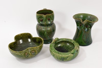 Lot 301 - Two Farnham Pottery green-glazed owl jugs, circa 1900, 14.5cm and 16.5cm high