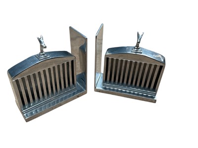 Lot 60 - Pair of contemporary polished aluminium bookends by Eichholtz in the form of Rolls - Royce radiator grills, originally retailed by Harrods, each 17.5cm in length.