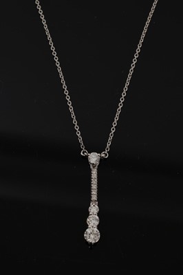 Lot 727 - Diamond pendant necklace with a graduated drop