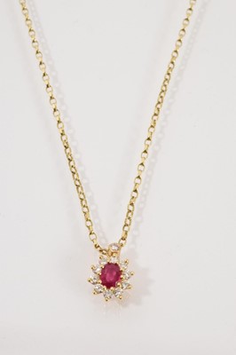 Lot 728 - Ruby and diamond cluster pendant in 18ct gold setting on 18ct gold chain