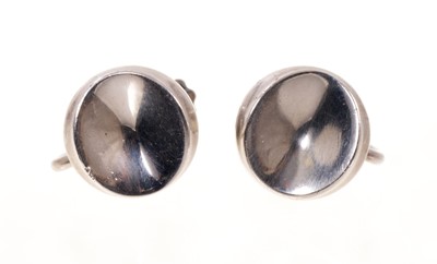 Lot 751 - Pair of Georg Jensen silver screw back earrings of concave disc design, number 136.