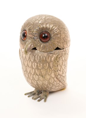 Lot 471 - Late 19th/early 20th century white metal model of an owl, with hinged head and glass eyes, apparently unmarked.