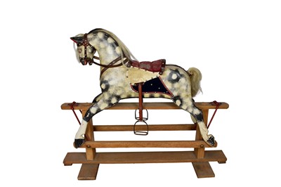 Lot 1500 - Early 20th century rocking horse, with painted dapple finish, swinging on X-frame, length of horse approximately 90cm, total length 116cm