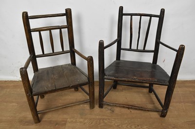 Lot 1505 - Two 19th century miniature country chairs, the first, with stick back and trapezoidal set on turned legs, 50cm high, the other of similar form, 51cm high