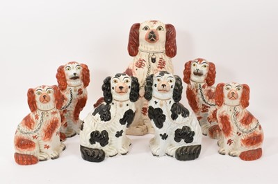 Lot 312 - Collection of Victorian Staffordshire spaniels, including three pairs and one larger, the largest measuring 39cm high (7)