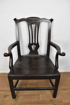 Lot 1508 - Early 18th century oak country open armchair, having pierced vase shaped splat, scrolled arms and plank seat on square supports and stretchers