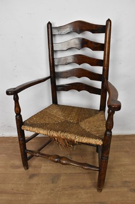 Lot 1511 - Early 19th century ash and elm ladder back armchair, with caned seat