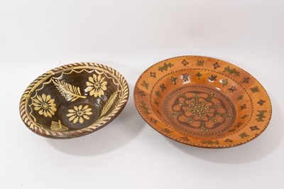 Lot 315 - Late Victorian John Chambers Art pottery charger in the Tudor style with green, brown and yellow glaze and rose and slip decoration - impressed mark to base, 39.5cm diameter, and a slipware bowl...