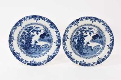 Lot 319 - Pair of 18th century Chinese blue and white porcelain plates, painted with scenes of deer and water buffalo, 22.5cm diameter