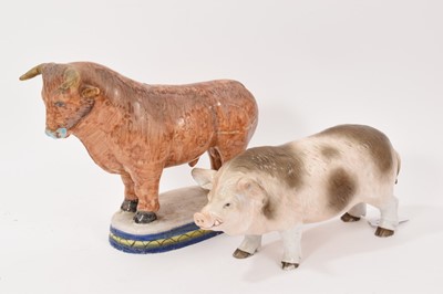 Lot 40 - Tin-glaze earthenware model of a bull, probably Dutch, polychrome painted on an oval base, 20.5cm high