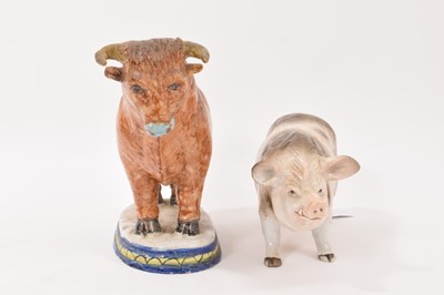 Lot 40 - Tin-glaze earthenware model of a bull, probably Dutch, polychrome painted on an oval base, 20.5cm high