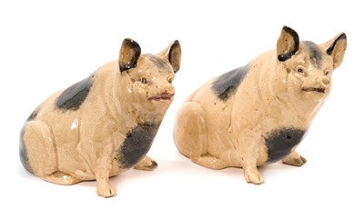 Lot 327 - A Scottish ceramic pig money box, early 20th century, marked to base, 15cm high, and a similar pig, 16cm high (2)