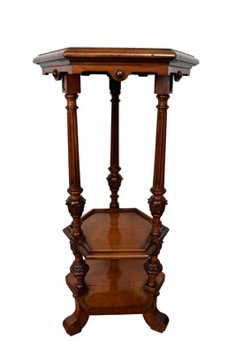 Lot 1548 - Good quality Victorian walnut tiered pedetal, of hexagonal outline with three dished tiers between carved and fluted supports, on scroll supports, the base weighted, 34cm wide x 78cm high