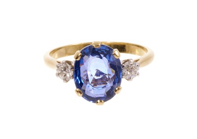 Lot 684 - Sapphire and diamond three stone ring