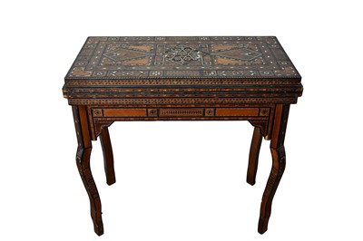 Lot 1570 - Ornate Damascus boxwood, bone and mother of pearl inlaid gaming table, the fold-over top enclosing further folding gaming boards and compartments, raised on shaped supports, 84cm wide x 42cm dee...