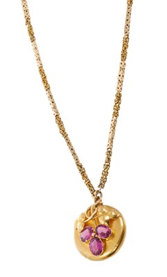 Lot 694 - Victorian gold and garnet pendant with locket back on a Victorian gold fancy link chain