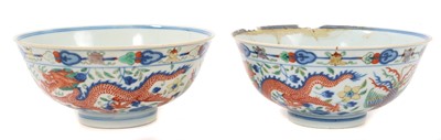 Lot 329 - A pair of Chinese porcelain bowls, Daoguang mark and period, decorated with a dragon and phoenix pattern in the Wucai style, 14.75cm diameter Provenance: brought home by Sir Francis Drum...