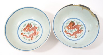 Lot 329 - A pair of Chinese porcelain bowls, Daoguang mark and period, decorated with a dragon and phoenix pattern in the Wucai style, 14.75cm diameter Provenance: brought home by Sir Francis Drum...