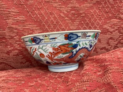 Lot 329 - A pair of Chinese porcelain bowls, Daoguang mark and period, decorated with a dragon and phoenix pattern in the Wucai style, 14.75cm diameter Provenance: brought home by Sir Francis Drum...